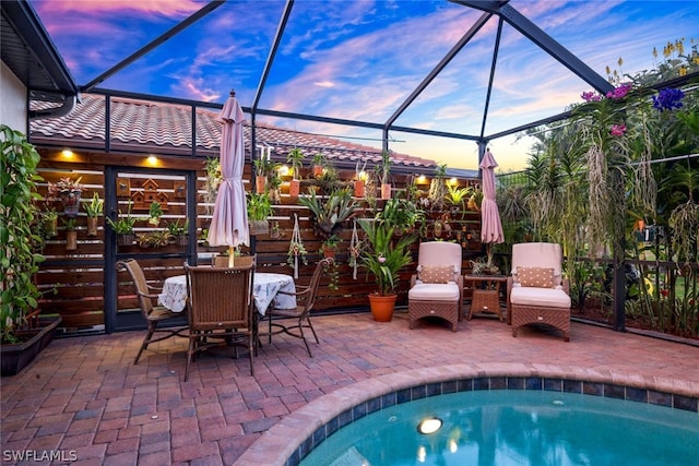 patio terrace at dusk with a lanai