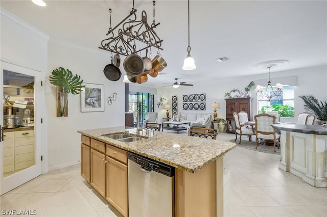 kitchen featuring crown molding, plenty of natural light, stainless steel dishwasher, and a center island with sink