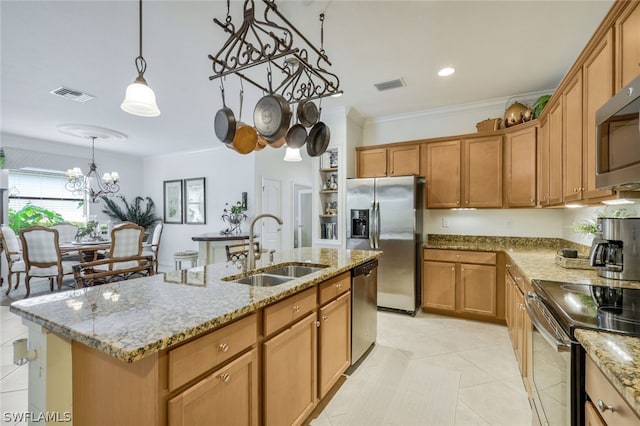 kitchen with sink, hanging light fixtures, stainless steel appliances, a kitchen island with sink, and ornamental molding