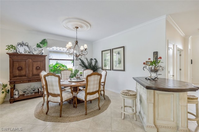 tiled dining space with a chandelier and crown molding