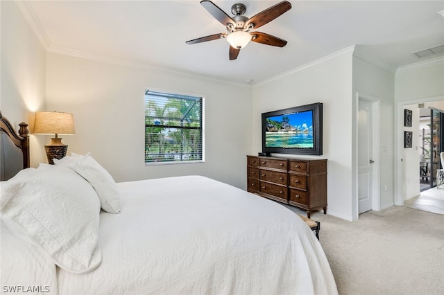 carpeted bedroom with ceiling fan and ornamental molding