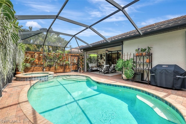 view of swimming pool with ceiling fan, a lanai, grilling area, a patio area, and an in ground hot tub