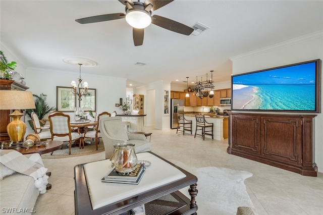 living room with ceiling fan with notable chandelier, light tile patterned flooring, and ornamental molding