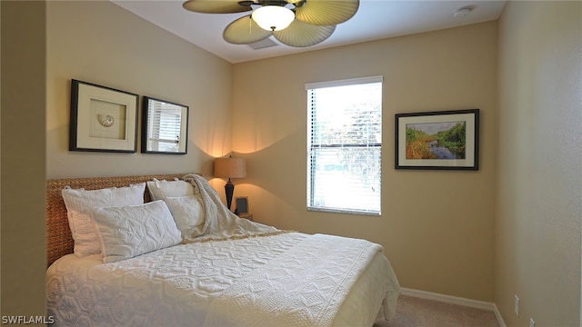 bedroom with ceiling fan and carpet floors