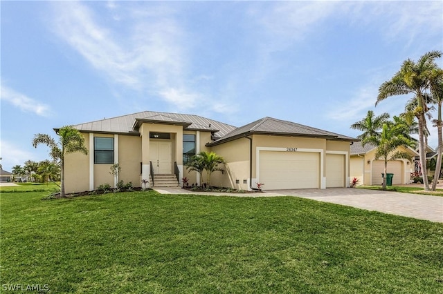 view of front of house featuring a front yard and a garage