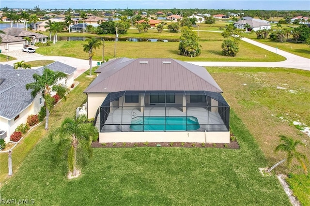 view of pool with a yard