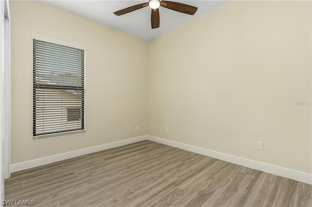 empty room with light hardwood / wood-style floors and ceiling fan