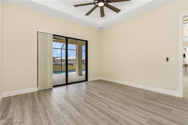 unfurnished room with ceiling fan and light hardwood / wood-style flooring