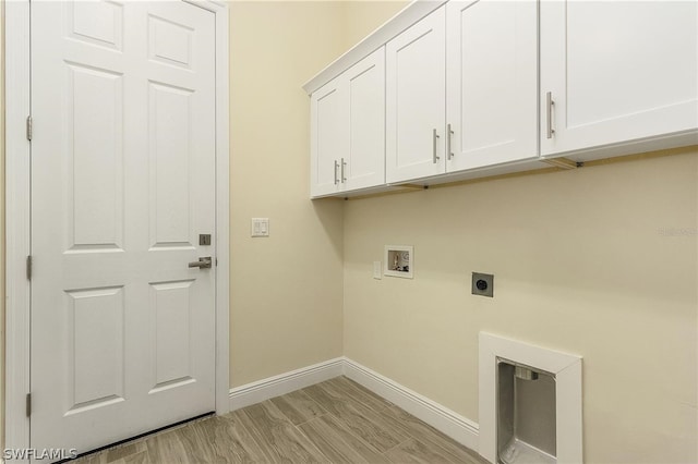 laundry room featuring washer hookup, cabinets, hookup for an electric dryer, and light hardwood / wood-style flooring