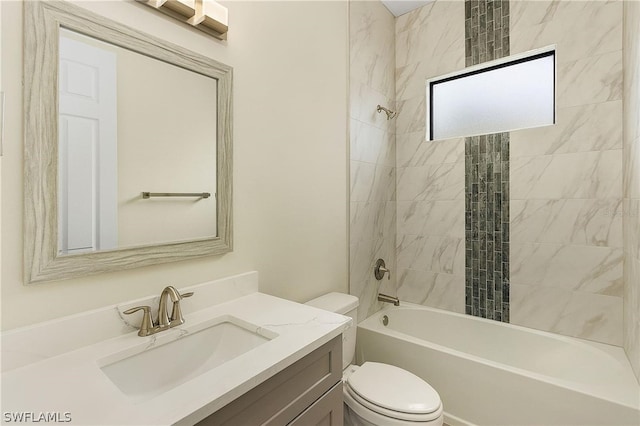 full bathroom with vanity, toilet, and tiled shower / bath