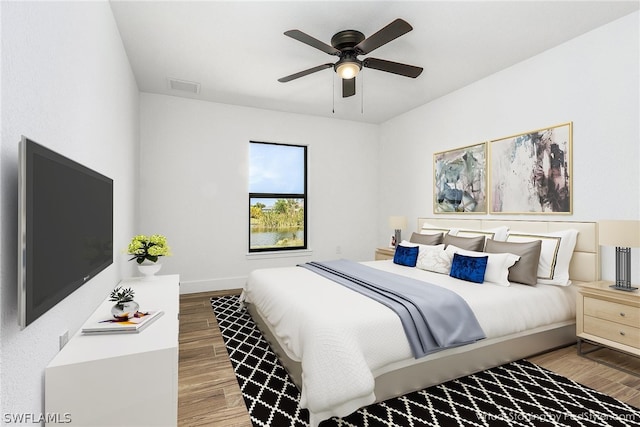 bedroom with ceiling fan and hardwood / wood-style floors