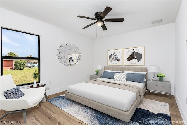 bedroom featuring hardwood / wood-style floors and ceiling fan