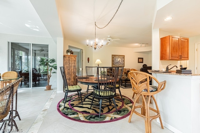 tiled dining space with an inviting chandelier