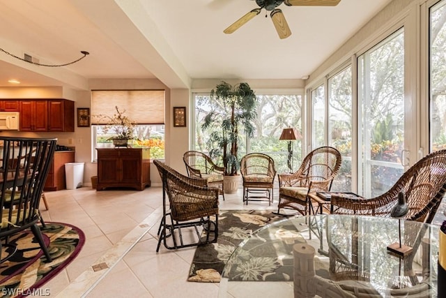 sunroom with a wealth of natural light and ceiling fan