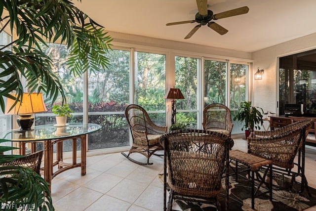 sunroom featuring ceiling fan