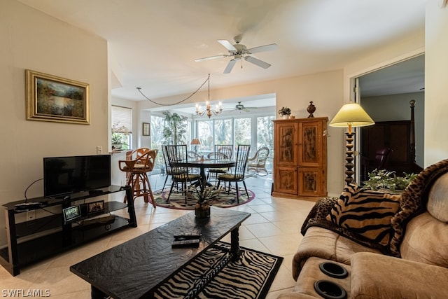 living room with ceiling fan with notable chandelier and light tile patterned floors