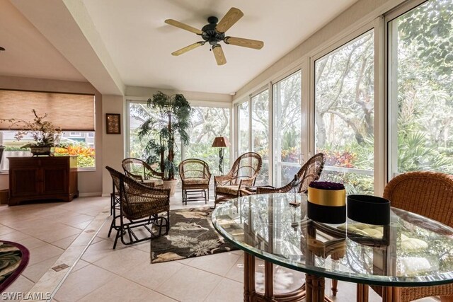 sunroom featuring a wealth of natural light and ceiling fan