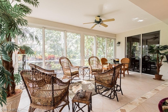 sunroom featuring ceiling fan