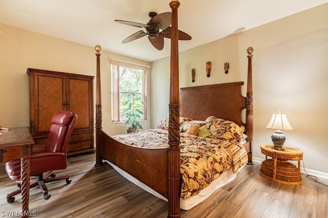 bedroom with hardwood / wood-style flooring and ceiling fan