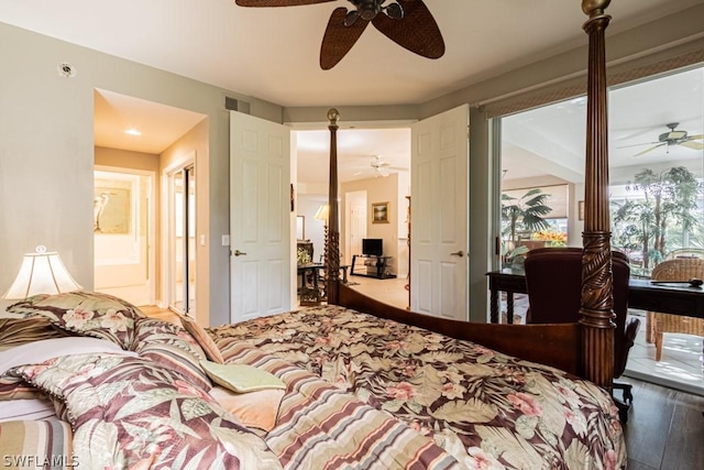 bedroom with hardwood / wood-style floors, ensuite bath, and ceiling fan