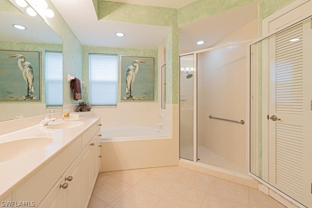 bathroom with tile patterned floors, vanity, and separate shower and tub