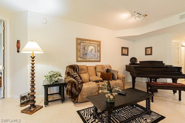 living room featuring light tile patterned floors and track lighting