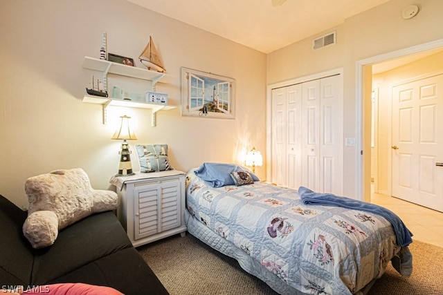 bedroom featuring carpet and a closet