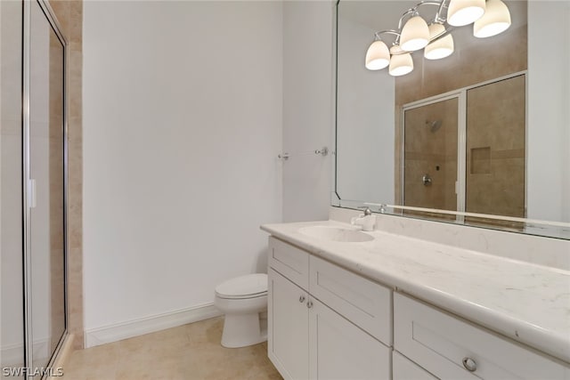 bathroom featuring tile flooring, toilet, an enclosed shower, and vanity with extensive cabinet space