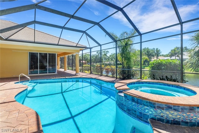 view of pool with glass enclosure, a patio area, and an in ground hot tub