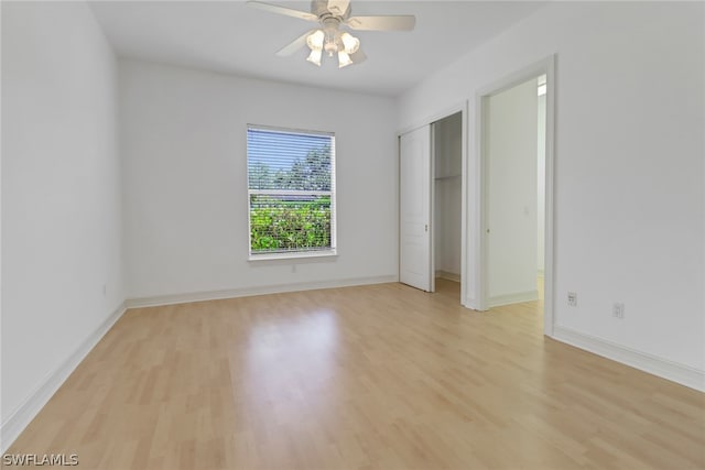 unfurnished room with ceiling fan and light hardwood / wood-style floors