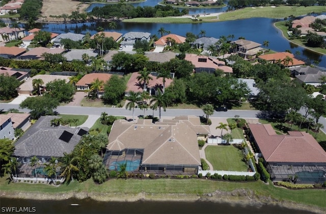 birds eye view of property with a water view