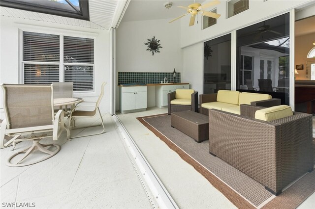 view of patio featuring ceiling fan and an outdoor living space