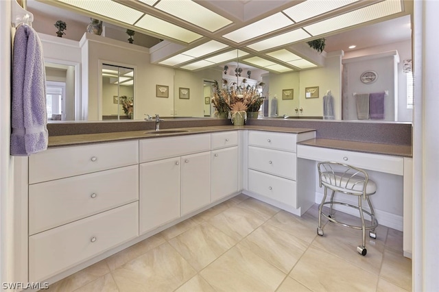 bathroom with vanity and tile flooring