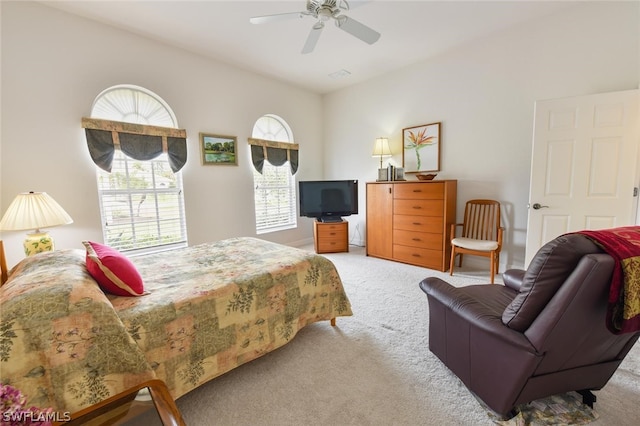 bedroom with light colored carpet and ceiling fan