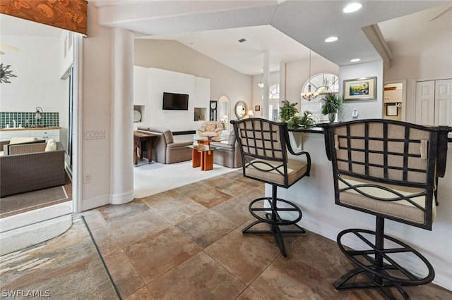 interior space featuring lofted ceiling and light tile flooring