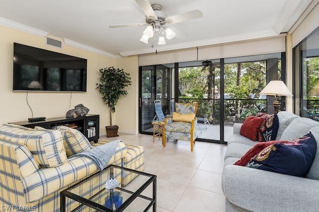 living room featuring light tile floors, ceiling fan, and crown molding