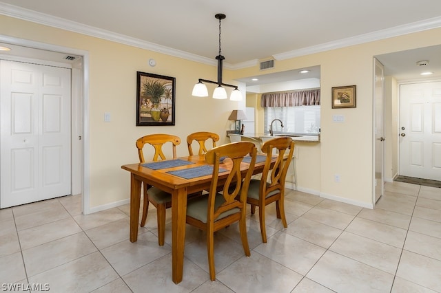 dining area with light tile flooring, ornamental molding, and sink