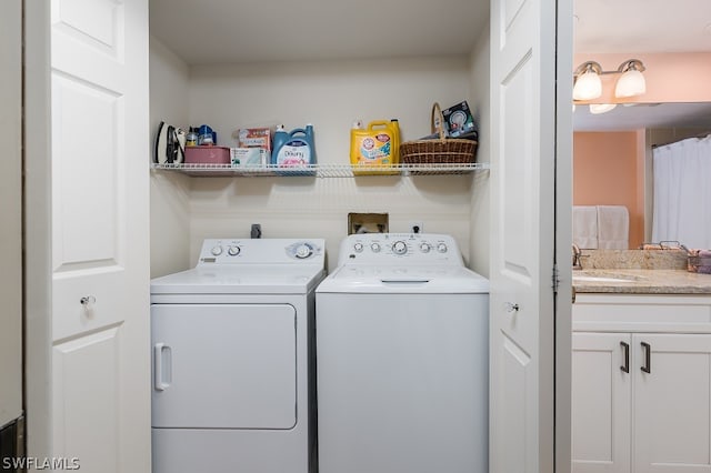 laundry area with washing machine and clothes dryer, hookup for a washing machine, electric dryer hookup, and sink