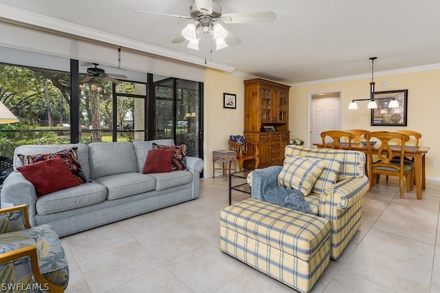 tiled living room with ornamental molding and ceiling fan with notable chandelier