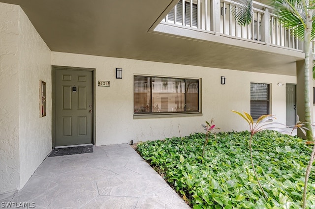 property entrance with a balcony