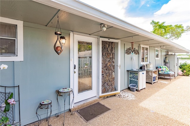 property entrance featuring a patio