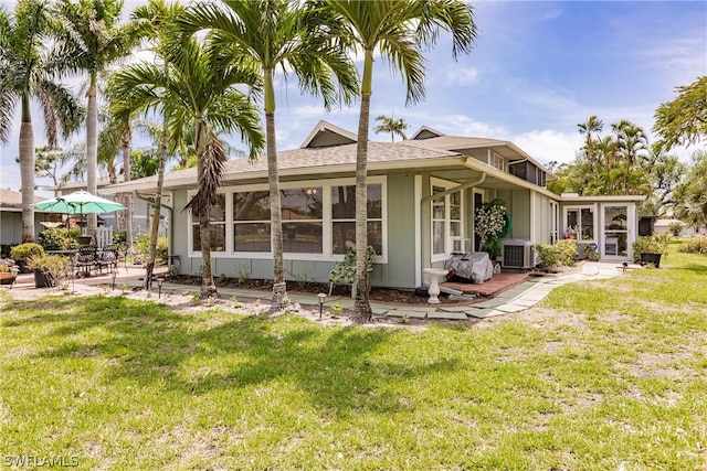 back of house with a yard, a patio, and central AC unit