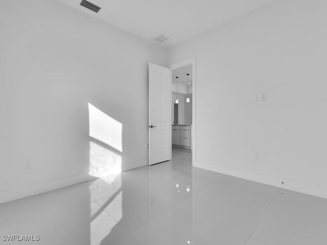 spare room with light tile patterned floors