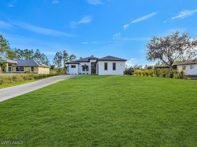 view of front of property with a front lawn