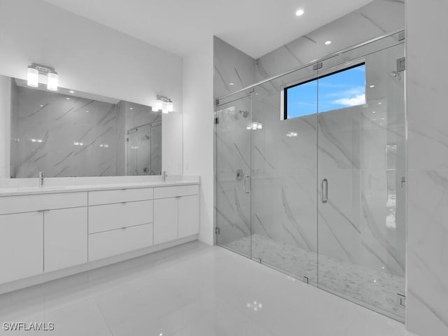 bathroom with vanity and walk in shower