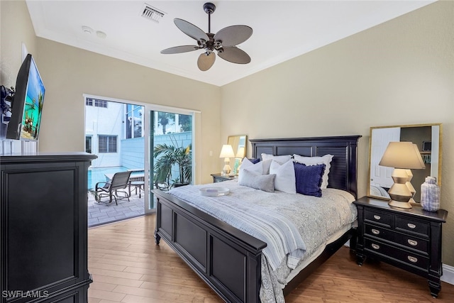 bedroom with light wood-type flooring, access to exterior, visible vents, and ornamental molding