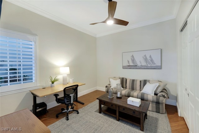 office space featuring baseboards, crown molding, and wood finished floors