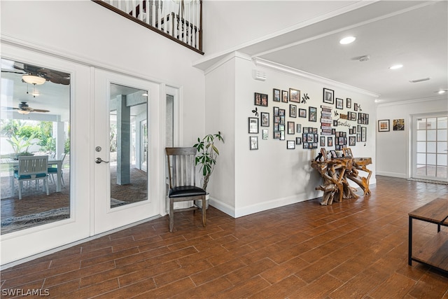 entrance foyer featuring ceiling fan, dark hardwood / wood-style floors, french doors, and ornamental molding