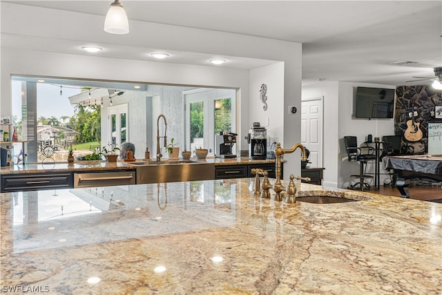 interior space with ceiling fan, sink, pool table, light stone countertops, and french doors