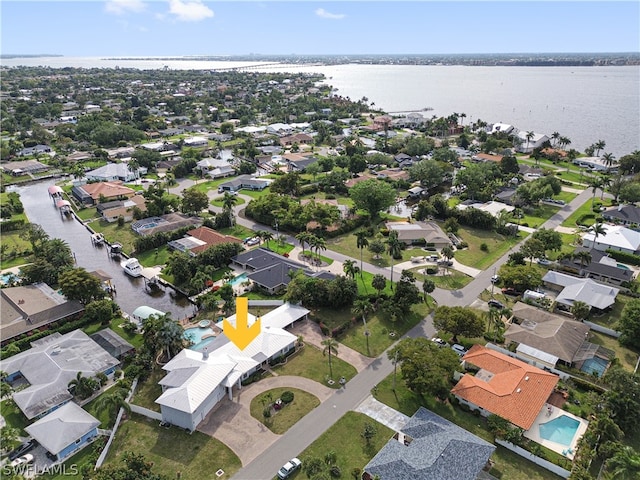 birds eye view of property with a water view